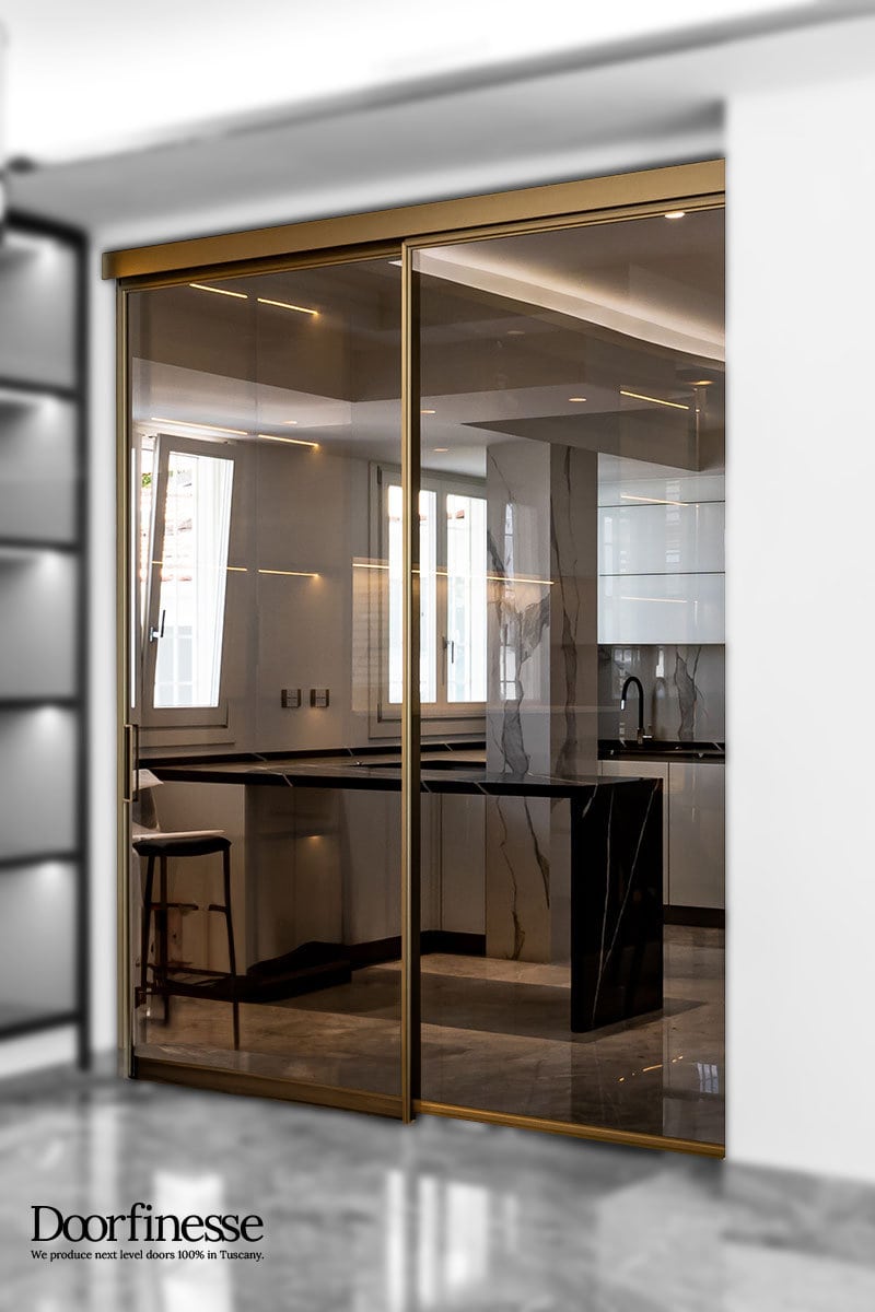 T-ES Design 17 porta scorrevole esterno muro, 2 ante, alluminio bronzo, vetro trasparente bronzo